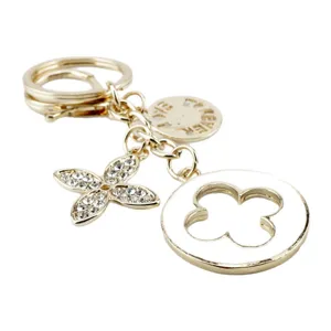 Portachiavi quadrifoglio dorato brillante strass ciondolo borsa elegante accessorio