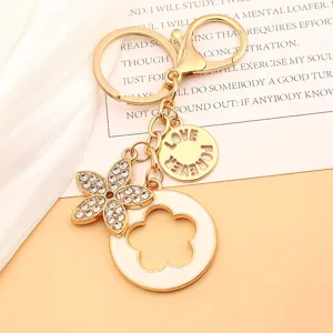 Portachiavi fiore strass oro pendente borsa metallo simpatico love forever charm donna