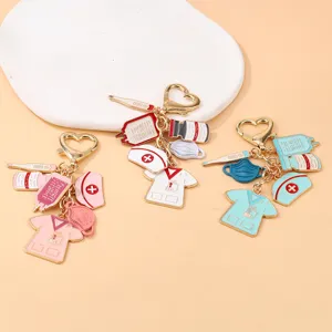 Detailed view of cute medical nurse themed enamel keychains featuring cute scrubs, caps and tools.