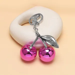 Glänzender rosa Kirsch Schlüsselanhänger und Taschenanhänger, stilvolles Metall Frucht Design.