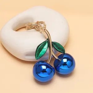 Blauer metallischer Kirschen Schlüsselanhänger Taschenschmuck mit grünen Glitzerblättern