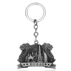 Dubai metal keychain featuring camel and iconic architecture design, perfect souvenir gift.