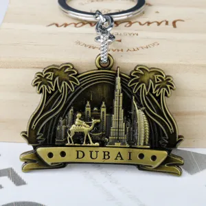 Metal Dubai landmark keychain with camel and architecture design, perfect souvenir gift pendant.