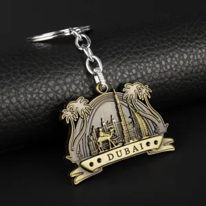 Dubai style metal keychain with landmark architecture and camel design, vintage bronze finish.