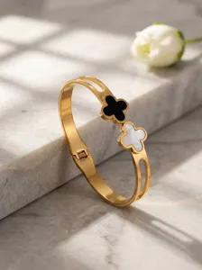 Stainless steel gold plated clover bracelet with black and white shell design.