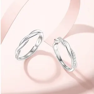 Stunning S925 silver couple rings featuring a twisted design with sparkling zirconia details.