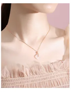 Close-up of the delicate S925 silver and white chalcedony peace buckle necklace pendant.