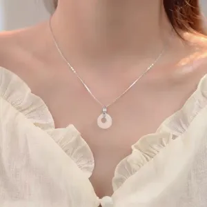 White chalcedony peace buckle pendant necklace detail showcasing the refined silver chain.