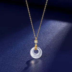 Close-up detail of the white chalcedony safety buckle pendant necklace with gold chain.