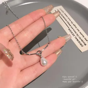 Collar de clavícula de moda minimalista elegante con perla y nudo de plata S999.