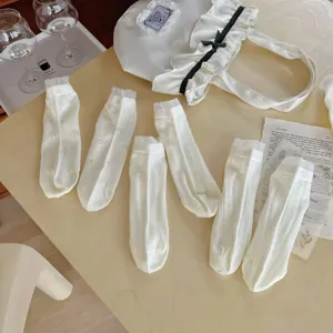 Chaussettes mi-hautes blanches en résille d'été, style mignon nœud respirantes.