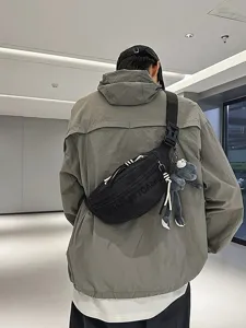 Trendy tactical chest bag, casual streetwear crossbody sling bag with cute frog pendant.