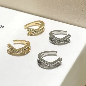 Pendientes de presion cruzados de plata esterlina 925 con circonitas de oro y plata