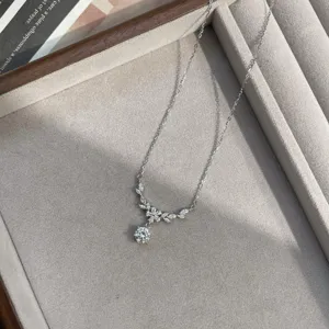 Silver flower zircon clavicle necklace detail shot showing delicate stone setting closeup.