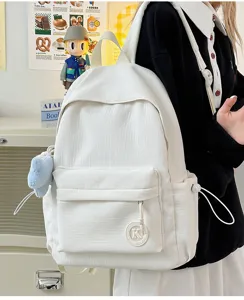 White minimalist canvas backpack detail, casual daily student bookbag with cute plush pendant.