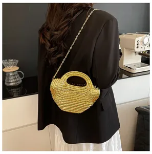 Stylish metallic gold acrylic chain evening bag for women, versatile shoulder crossbody bag.