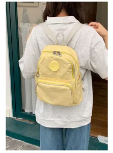 Sac à dos en nylon jaune décontracté pour femmes, cartable élégant avec multi-poches.