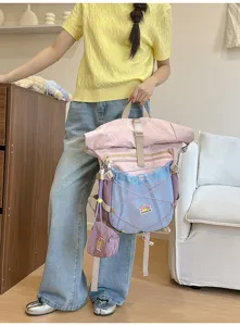 Stylish color-block roll-top backpack with front mesh pocket and cute attached pouch for daily use.