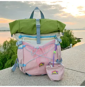 Multi-color roll-top student backpack outdoor view showing large capacity and fresh style.