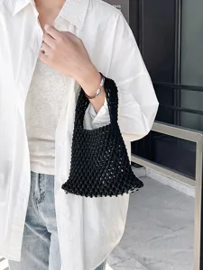 Sac à main en filet tissé noir minimaliste pour femmes, sac de plage chic fait à la main.
