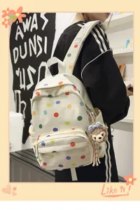 Mochila escolar informal de lunares de colores con bonito colgante de oso para estudiantes.