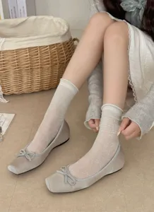 Delicate sheer mesh crew socks with cute bow details, perfect lightweight summer hosiery.