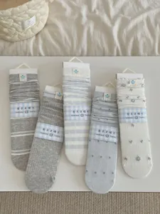 Lightweight women crew socks cute floral striped pile design for autumn daily wear styling.