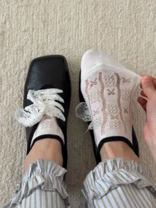 Detail view of women summer sheer glass silk short socks with cute bow pattern, breathable.