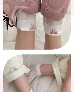Close-up detail of women breathable mesh summer short socks with cute pink bow embroidery.