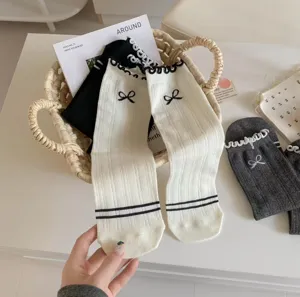 Japanese balletcore cotton socks with cute bows, lettuce edge, and cozy mid-tube design.