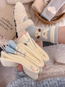 Thickened fuzzy winter socks with cute cartoon puppy and heart patterns for cozy home wear.