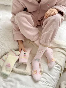 Plush fuzzy winter socks for women, thick warm sleeping socks with cute cartoon designs.
