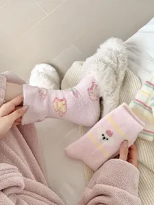 Fluffy winter socks detail, cute cartoon pattern, thick cozy plush material for warm sleep.