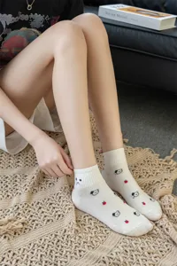 Cute cotton short socks for women featuring cute bear and apple patterns. Soft and breathable.