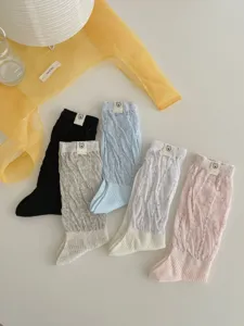 Korean style mid-calf socks detail, cute rabbit tag design, comfortable knit fabric.