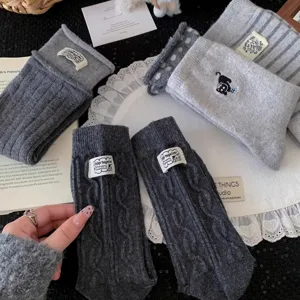 Winter thick wool socks for women, cozy grey knit crew socks with cute cat embroidery.