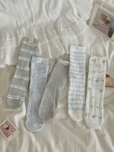 Women's cute mid-calf socks set, featuring stripes, dots and floral patterns for daily wear.