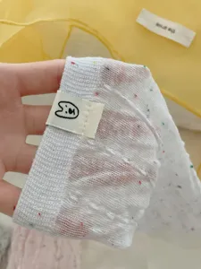 Korean style sheer mid-calf socks with colorful speckles and cute label detail for women