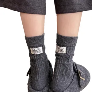 Grey thick cable knit winter wool socks for women, cozy warm cute cartoon mid-tube fashion.
