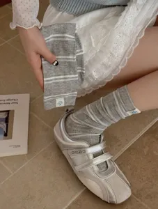 Grey striped mid-tube socks detail view, premium soft cotton material for daily casual styling.