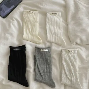Korean style cute cotton mid-tube socks with hollow pattern and rolled cuff design for women