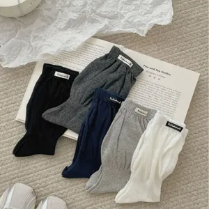 Calze slouchy lunghe minimaliste, calze al polpaccio in maglia tinta unita per autunno inverno.