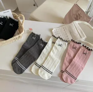 Sweet Japanese style ruffle bow cotton mid tube socks for women, cute balletcore daily wear.