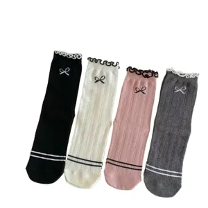 Sweet ballet-core women cotton mid-tube socks featuring cute ruffles and bows for daily wear.