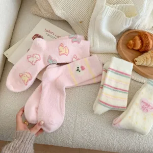 Cozy plush winter mid-calf socks featuring cute cartoon patterns and soft furry texture.