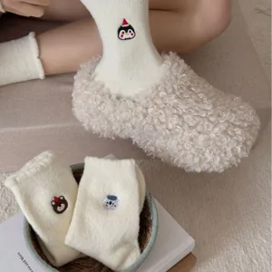 Cozy white plush fleece socks with cute cartoon embroidery and warm fuzzy slippers for winter.