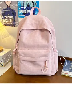 Minimalist pink casual student backpack for daily commute, lightweight school bookbag.