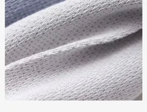 Close-up fabric texture detail of breathable mesh men socks showing cotton knit quality.
