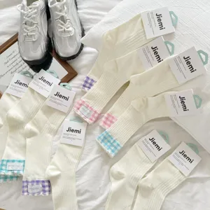 Cute women crew socks with plaid cuffs, soft cotton daily casual hosiery for spring and summer.