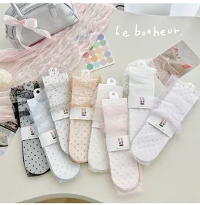 Sheer mesh polka dot mid-tube socks with ribbon ties, sweet balletcore style summer hosiery.